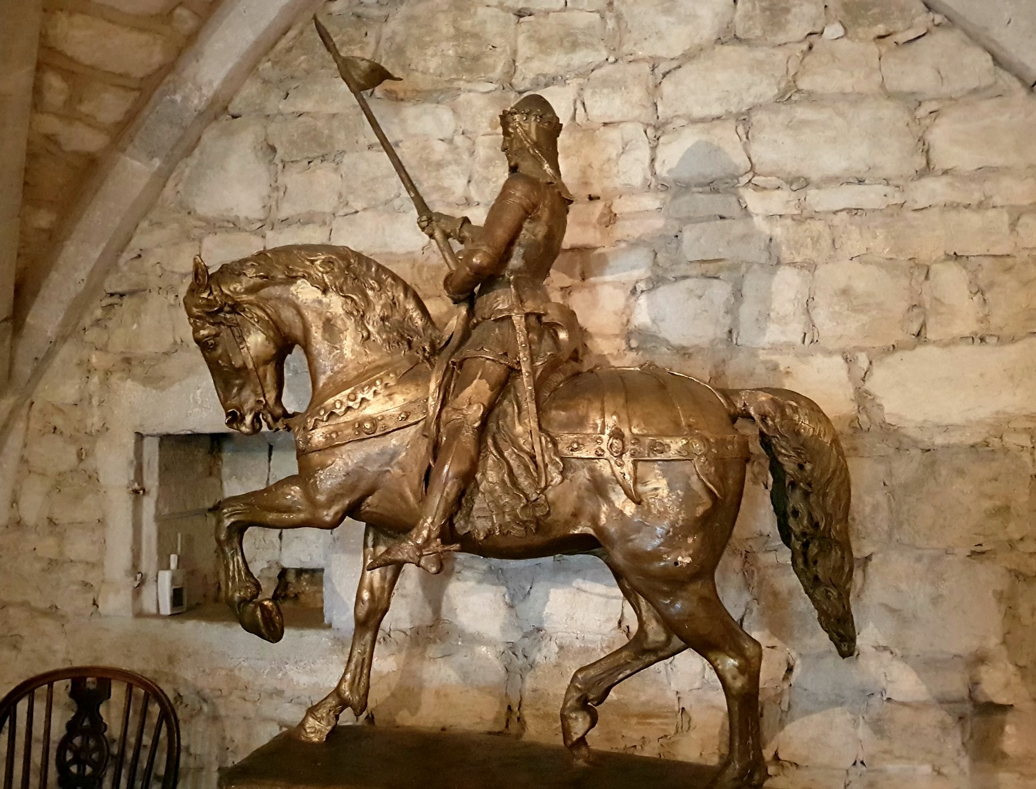 Metal statue of Knight in armour on a horse, at Ightham Mote National Trust