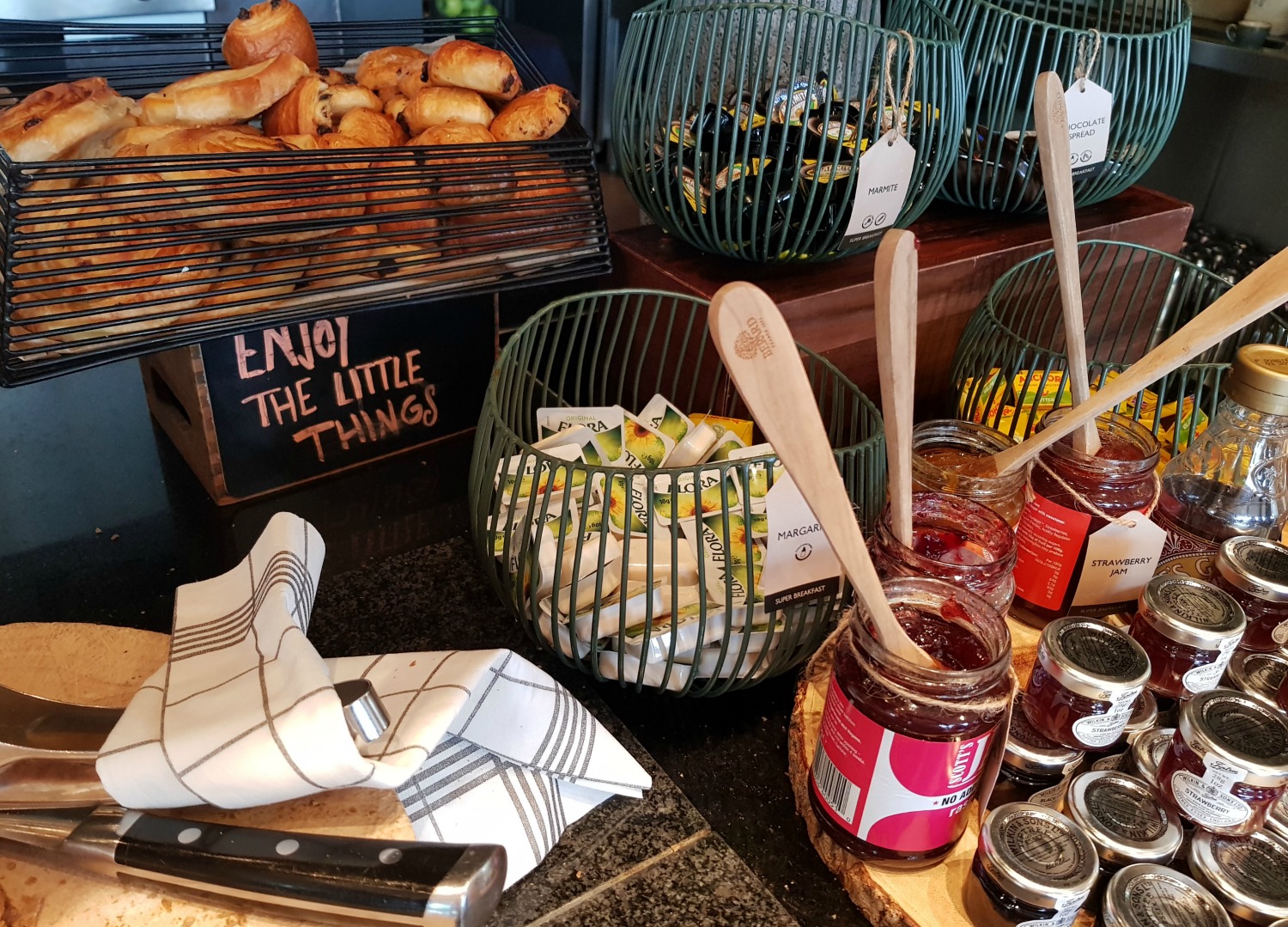 Basket of pastries and croissants plus jams, butter and marmite- breakfast at Radisson Blu Birmingham hotel