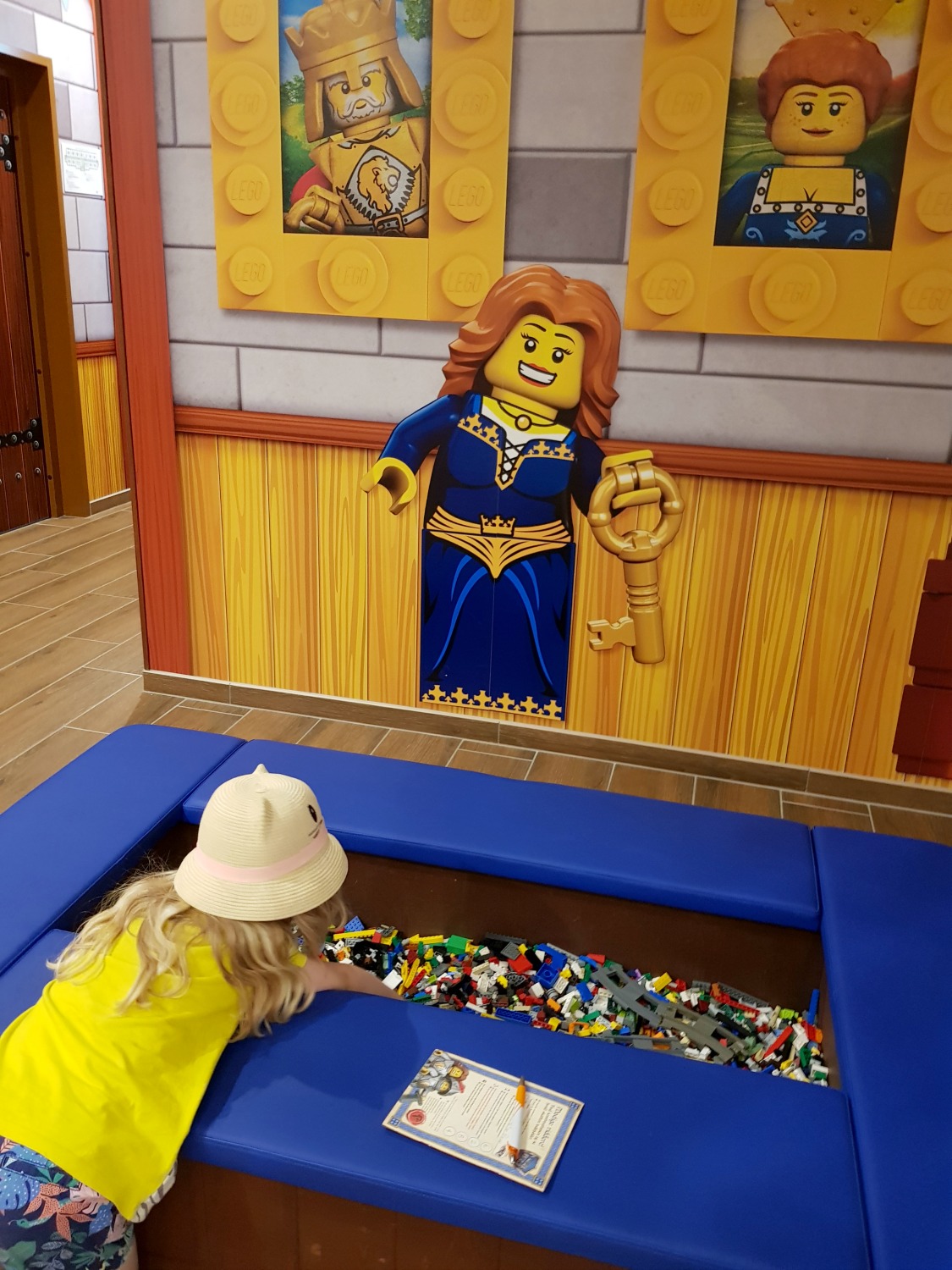 My daughter rummages in one of the huge boxes of Lego in the lobby of the Legoland Castle hotel - my review of the Legoland Castle hotel in Billund, Denmark