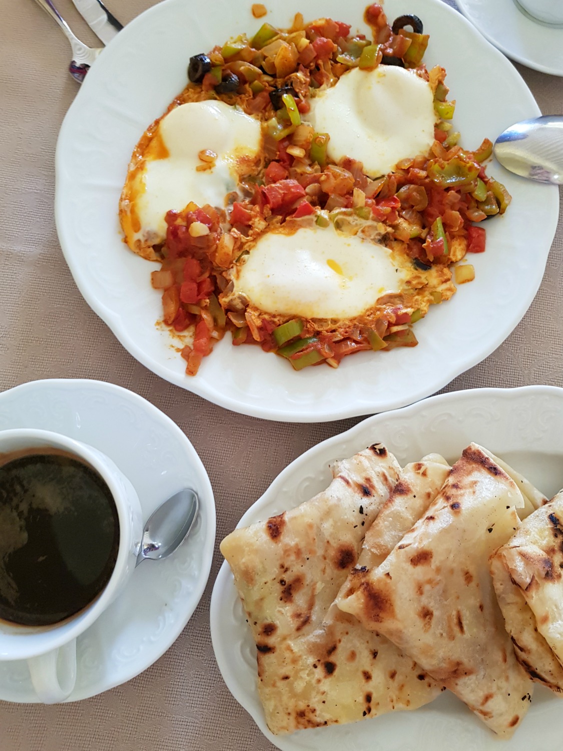Shakshuka with Tunisian flatbread and black coffee - just a few of the 10 courses served to us for breakfast at Palais Bayram boutique hotel in Tunis