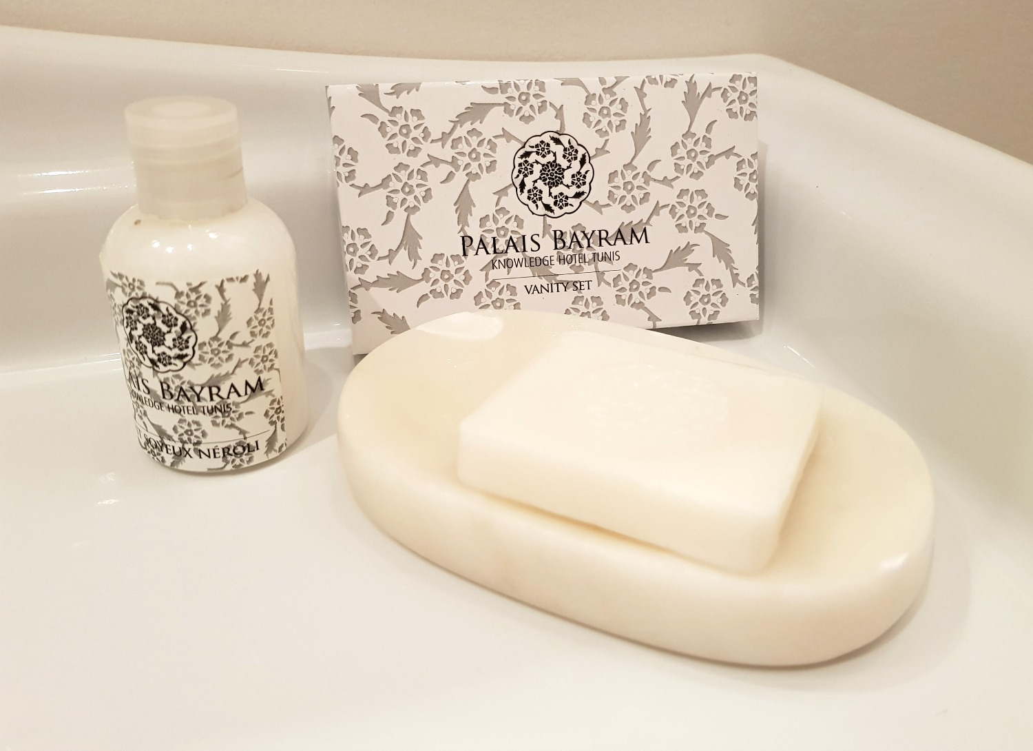 Branded toiletries and soap in a dish in the bathroom of one of the grand historic suites at Palais Bayram boutique hotel - my review of Palais Bayram in Tunis