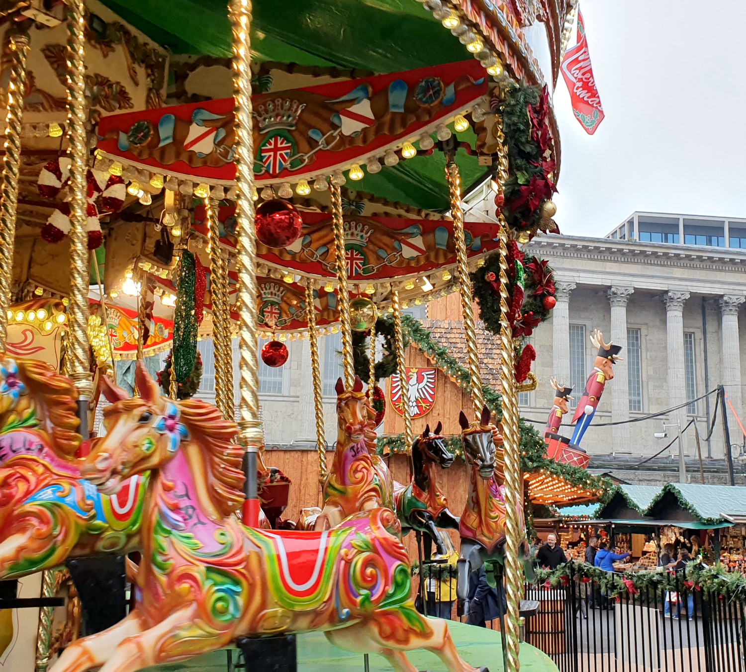 Gilded horses on the carousel at the Birmingham Christmas market on Victoria Square - visiting Birmingham Christmas market with kids