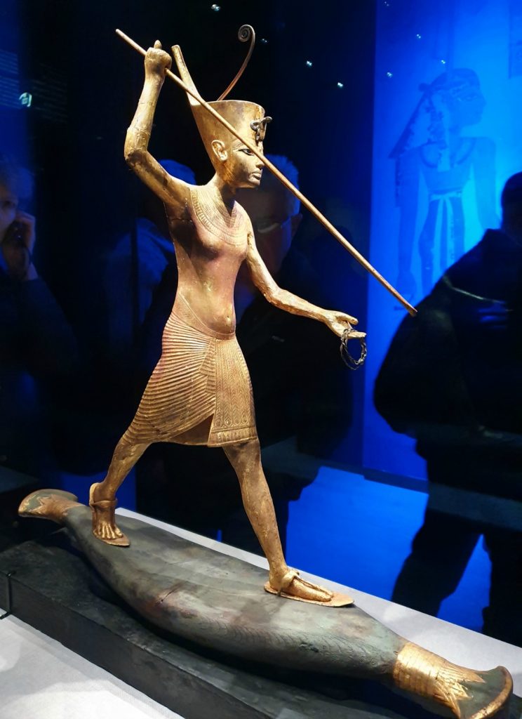 Golden statue of Egyptian Pharaoh Tutankhamun at the exhibition in London
