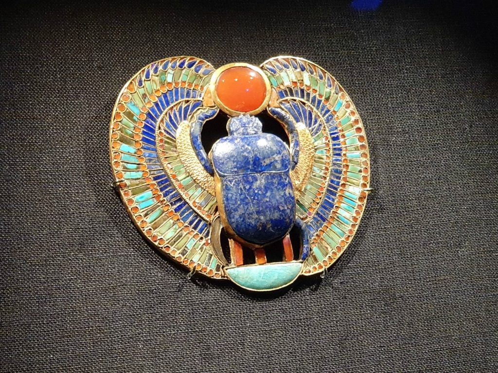 Decorative jewellery with blue scarab at the Treasures of the Golden Pharaoh - should you visit London Tutankhamun exhibition with kids