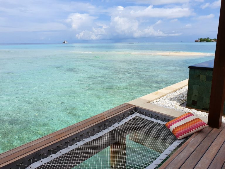 View from the deck of our water villa at one of the Four Seasons Maldives resorts - my review of a stay at Kuda Huraa with kids