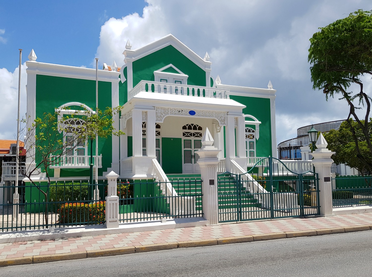 The bright green and white building of the Oranjestad town hall in Aruba