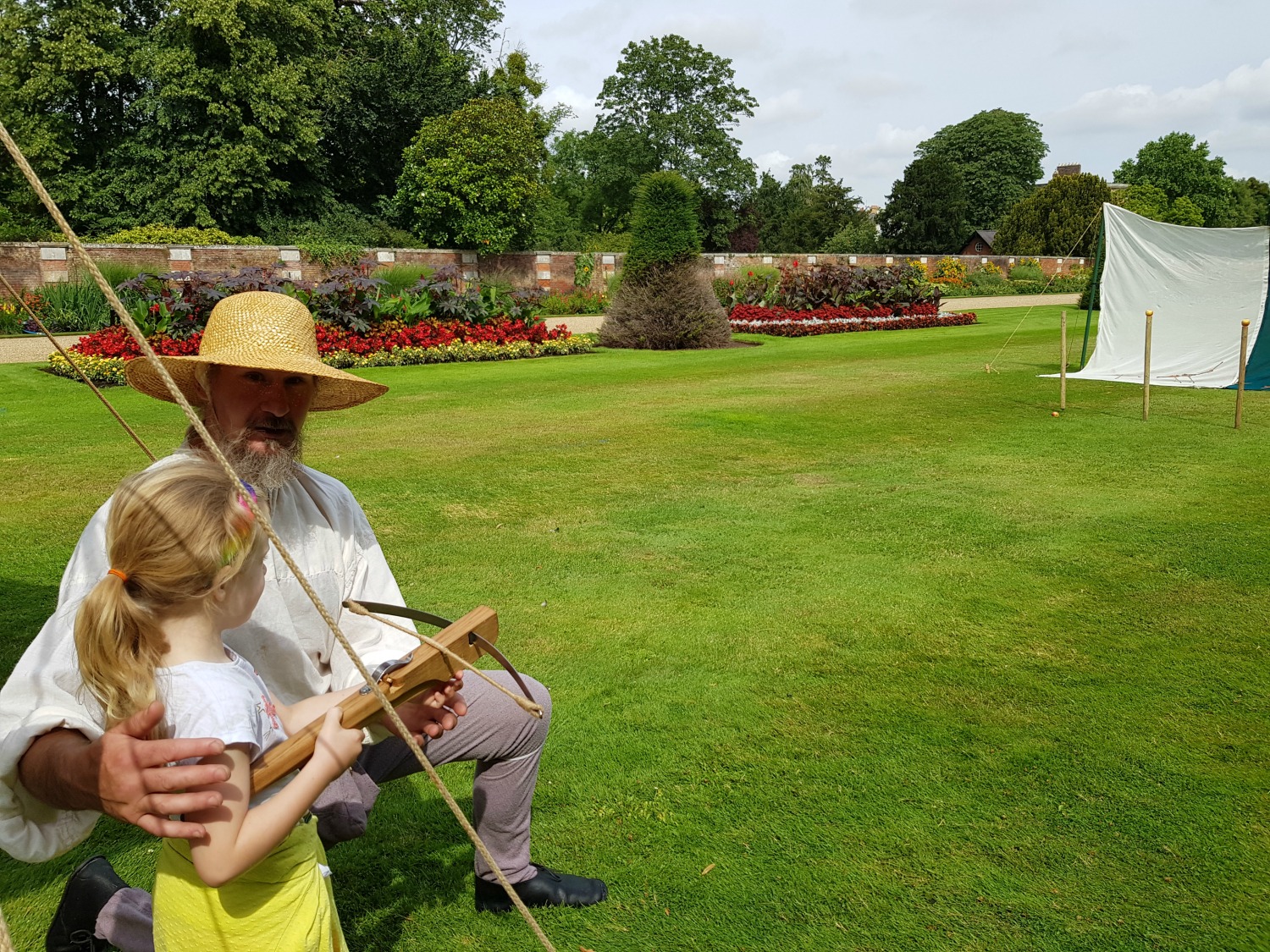 My daughter trying her hand at archery at the Henry VIII sporting academy at Hampton Court Palace, one of the special activities for the school summer holidays