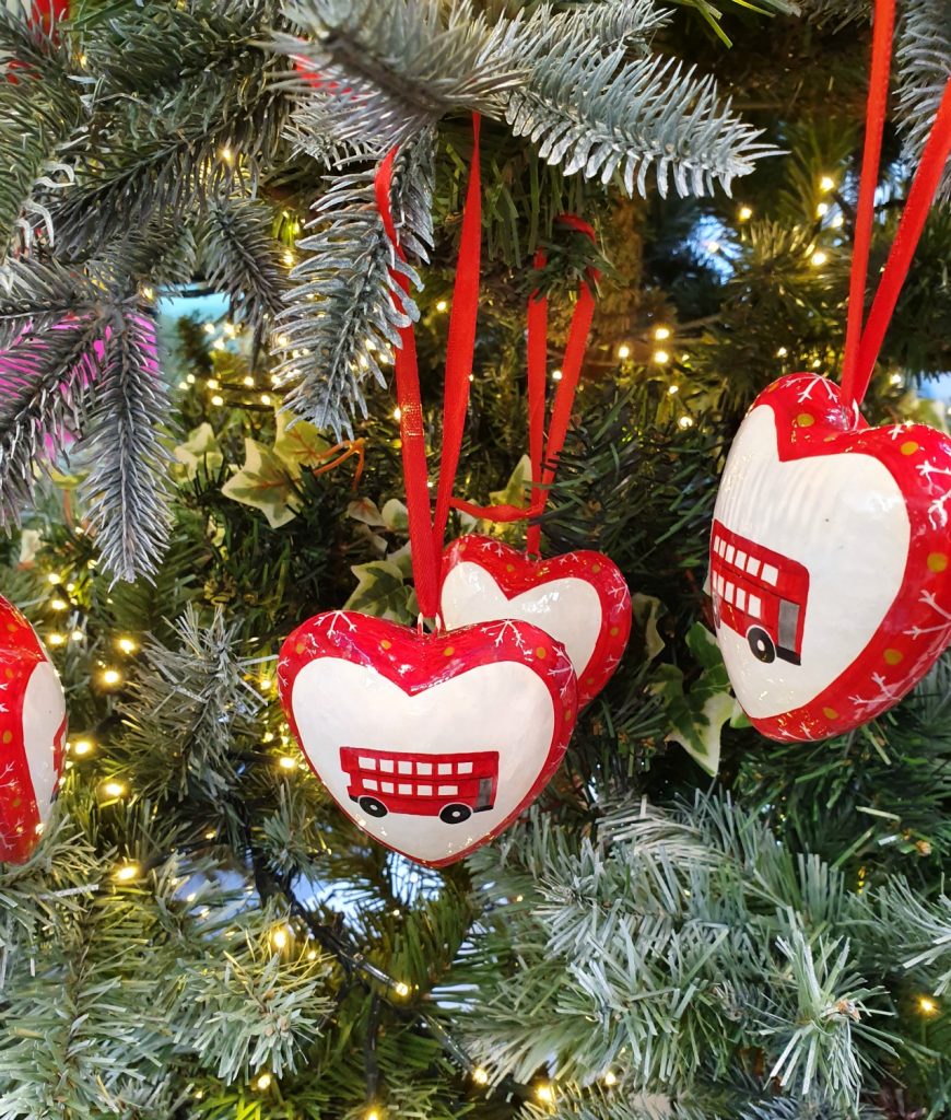 London Transport Museum Christmas bus baubles on a tree display in the shop