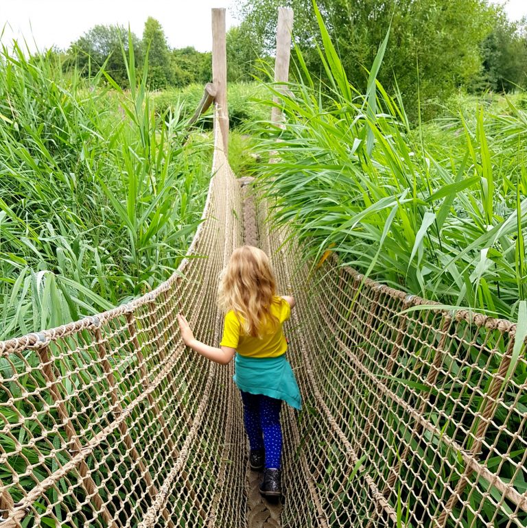 My daughter walks across the wild walk ropes course at the London Wetland Centre in Barnes, one of our best family travel of 2019