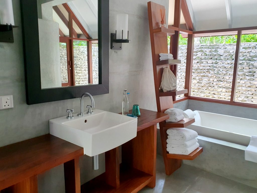 One of the sinks and part of the bath in the bathroom of our Landaa Giraavaru beach villa in the Maldives