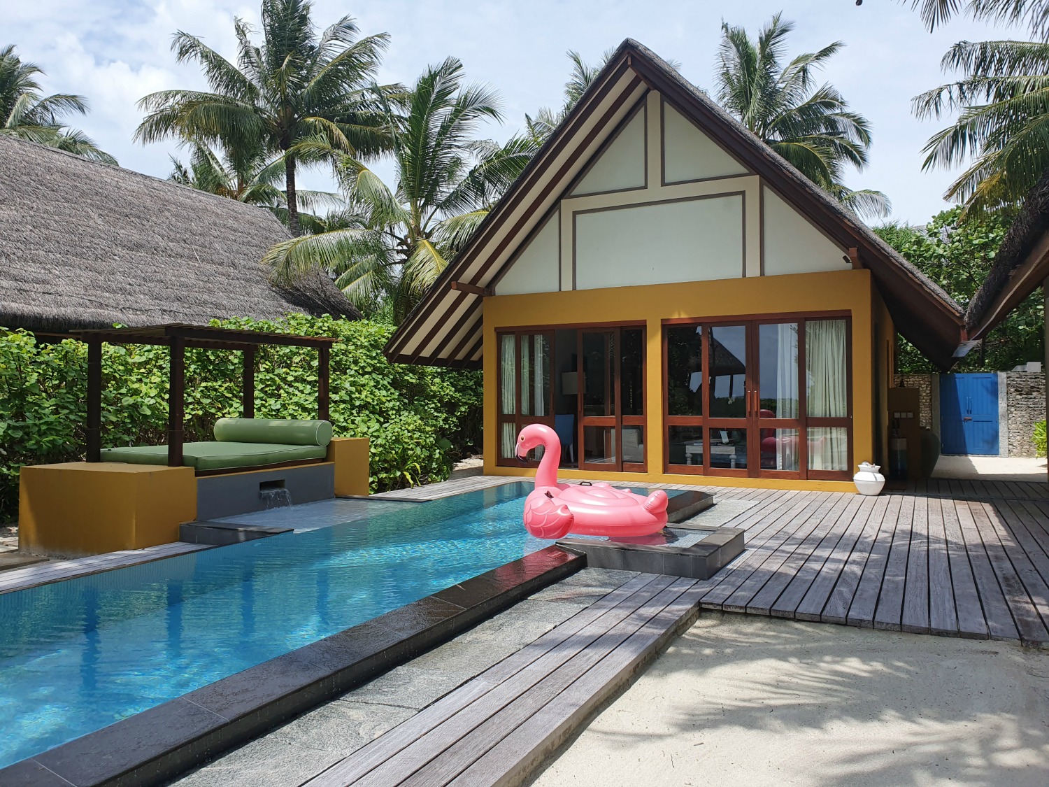View of our beach villa with inflatable flamingo by the pool at Landaa Giraavaru resort in the Maldives