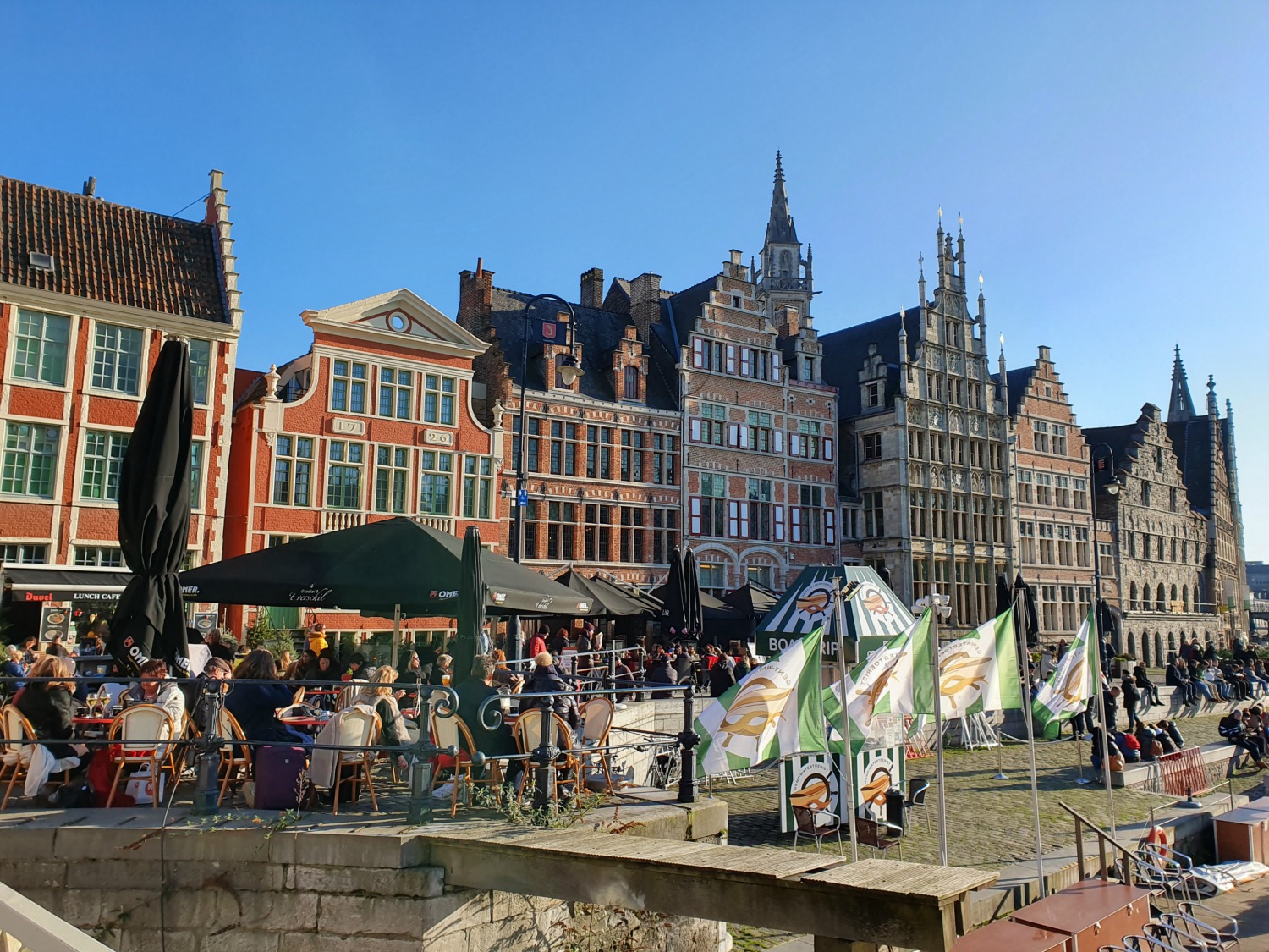 View along Graslei in the old town of Ghent, Belgium with some of the waterside restaurants - one of the best cities to visit in Belgium with kids
