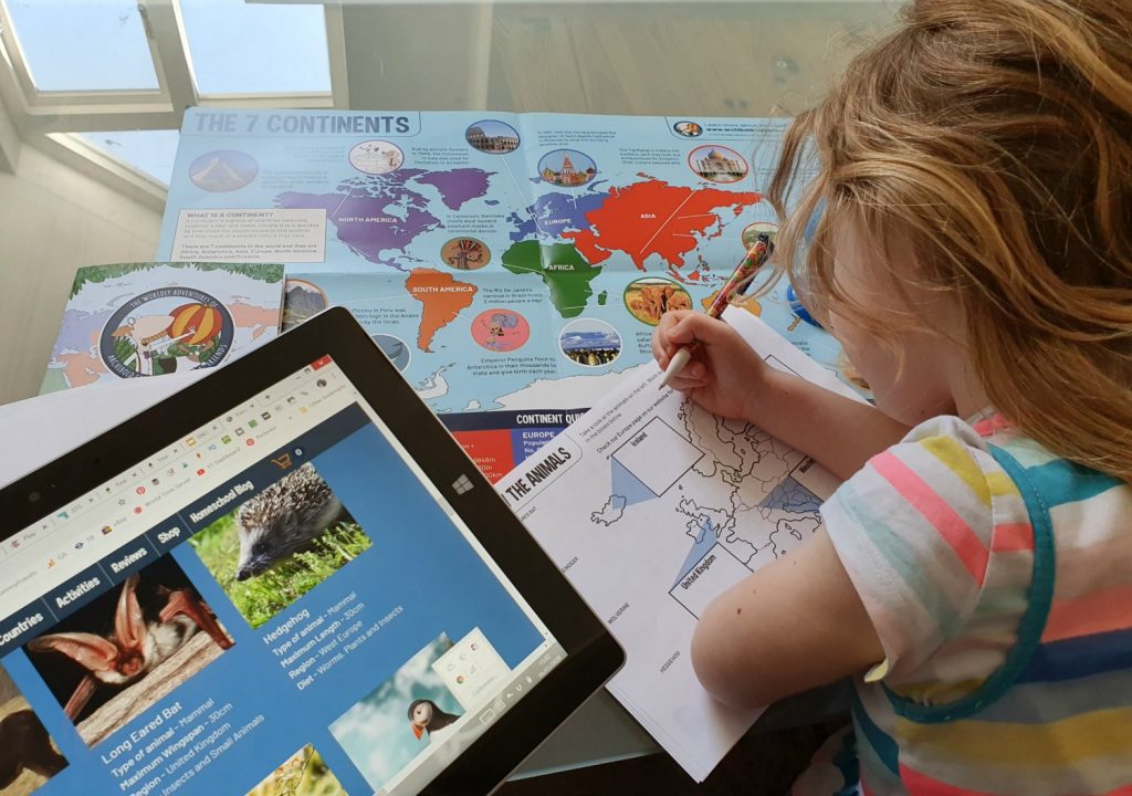 My daughter learning about European animals using the website, map and free travel activity pack on Europe from The Worldly Adventures of Archibold Clutterbuck - my review of this geography homeschool range