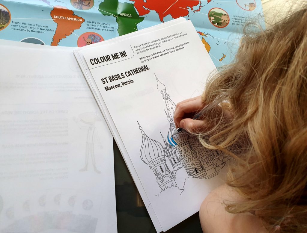 My daughter colouring in St Basil's cathedral, part of the free travel activities to download from The Worldly Adventures of Archibold Clutterbuck - my new recommendation for homeschool geography