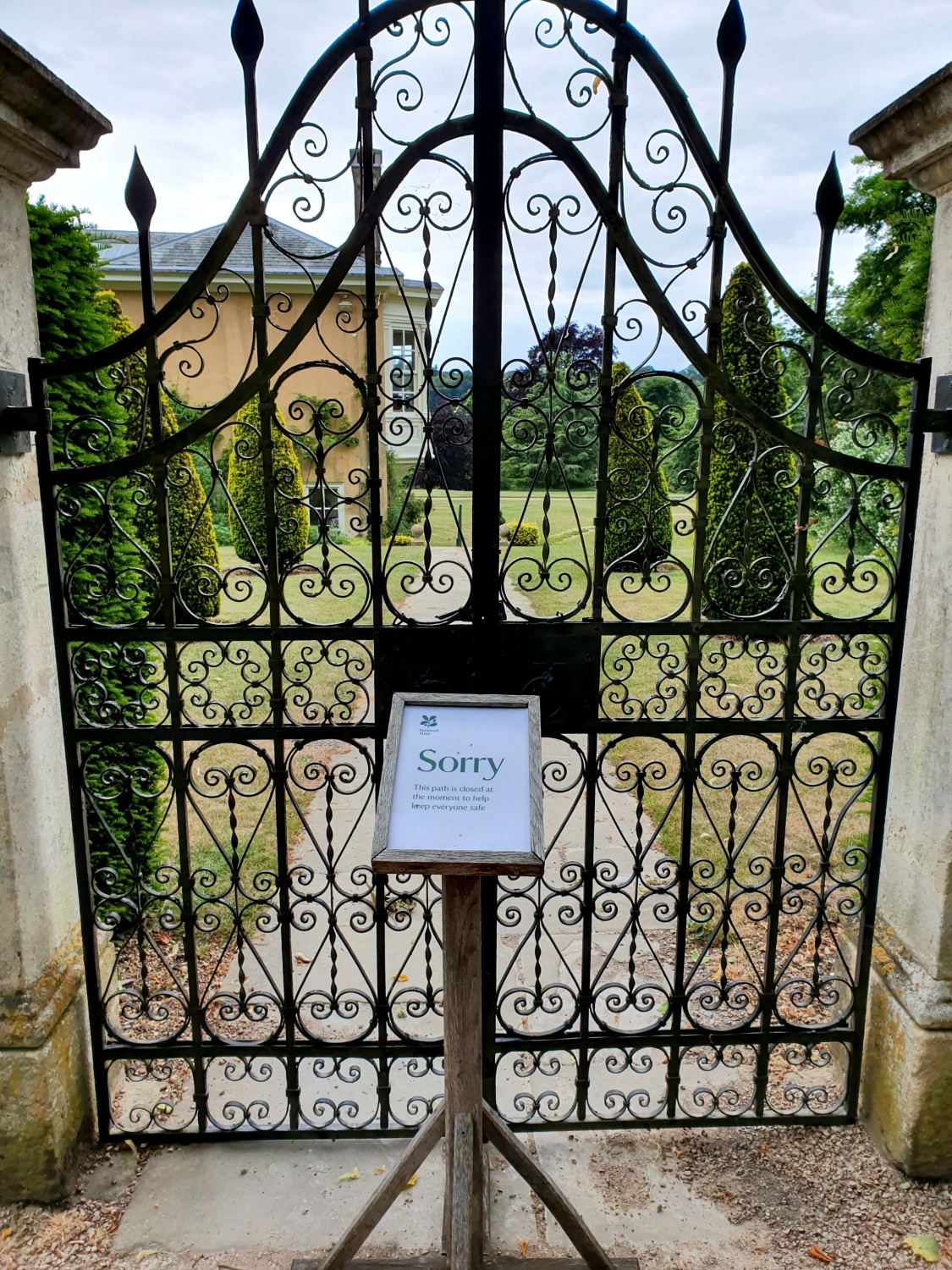 View of Polesden Lacey house through closed gates with a sign saying Sorry - our visit to Polesden Lacey after lockdown one of the first National Trust reopened sites