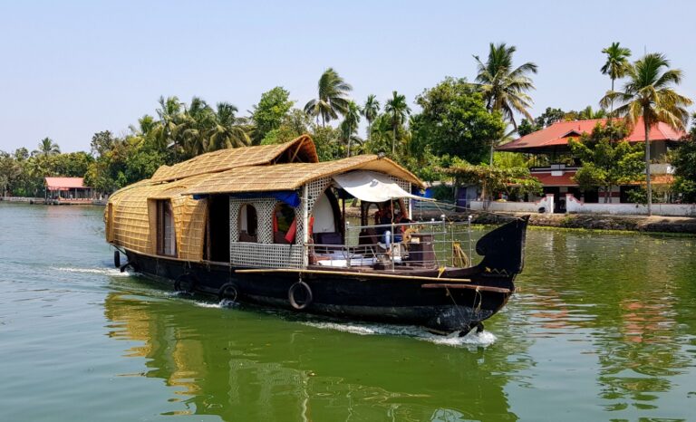 A houseboat on the backwaters of Kerala in India - the area's history and culture are one of my top reasons to visit Kerala
