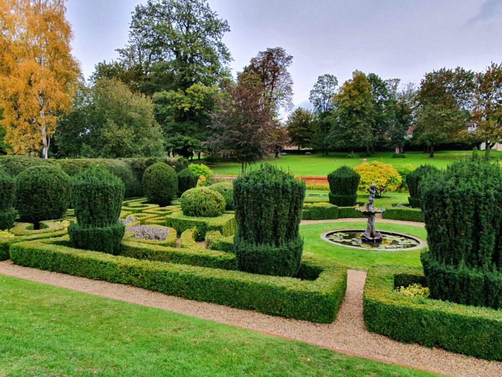 View of the formal Dutch Garden at Bridge End Gardens in Essex, a great place to get outdoors during a weekend in Saffron Walden with kids