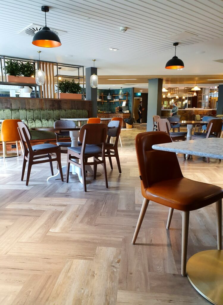 View of the breakfast area at Holiday Inn Winchester where there's currently an assisted buffet service - one of the best places to stay in Winchester with kids