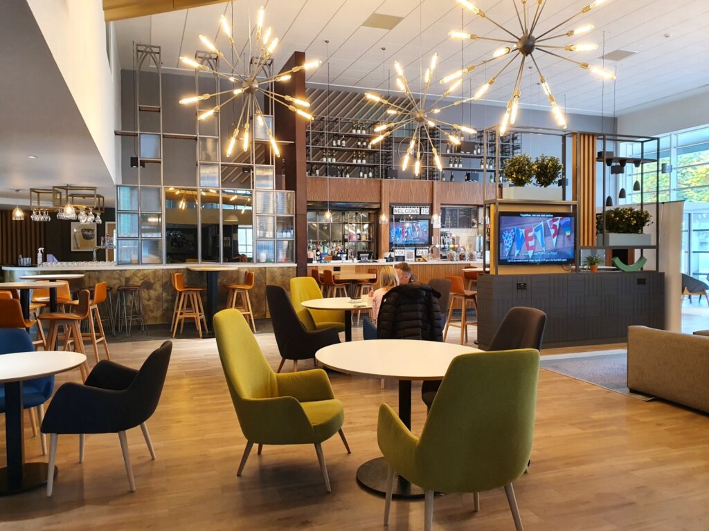 Huge starburst lights in the lobby and bar area of Holiday Inn Winchester - one of the best places to stay in Winchester with kids