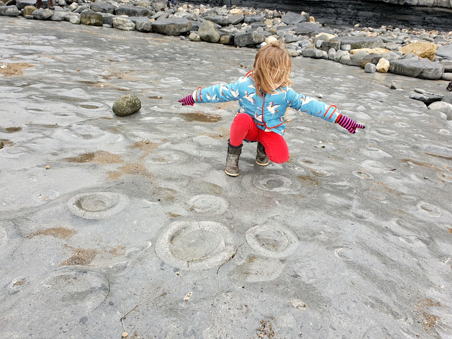 My daughter on the ammonite pavement at Lyme Regis during our family holiday to Dorset