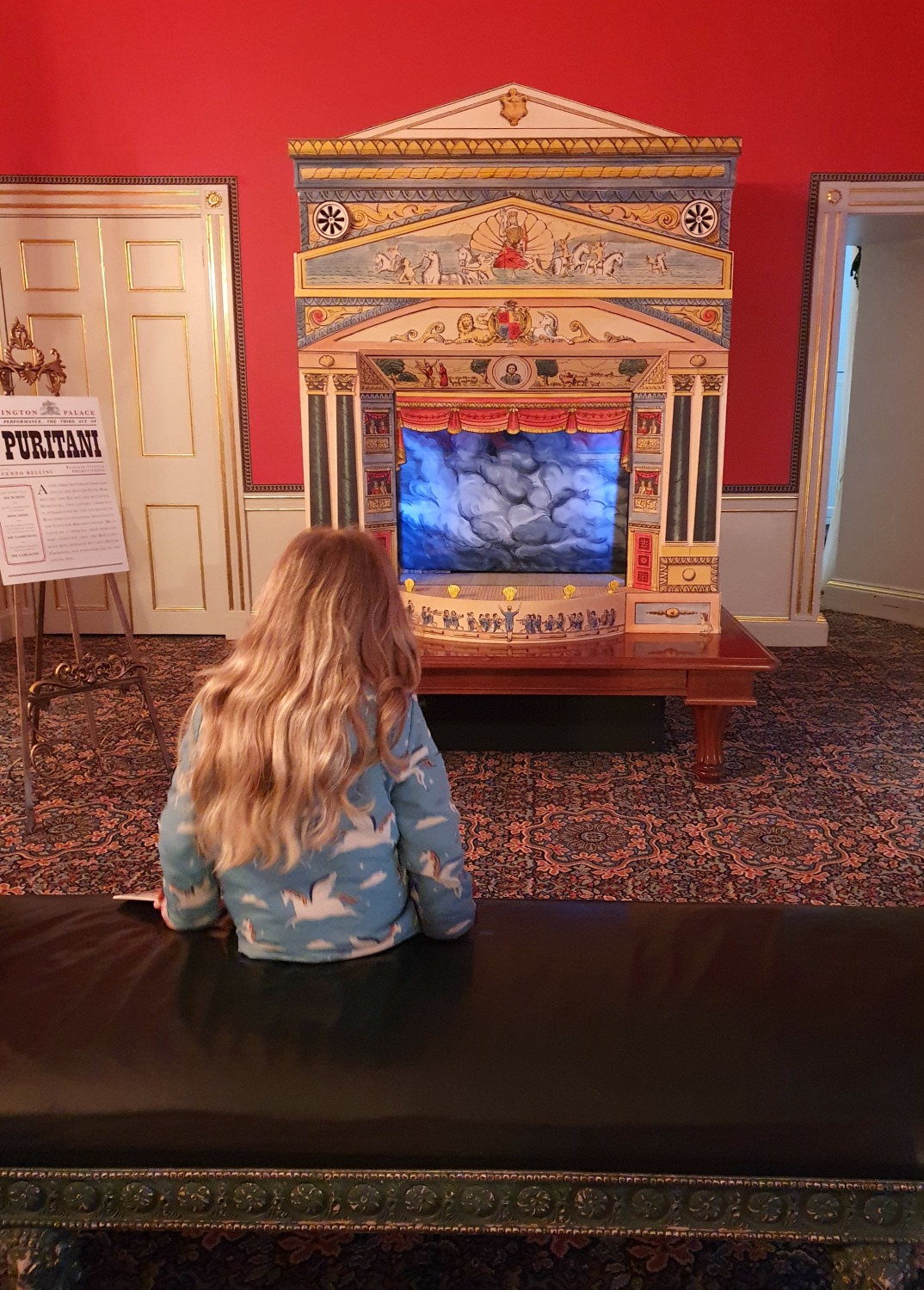 My daughter looks at a miniature theatre displaying a Bellini opera at Kensington Palace