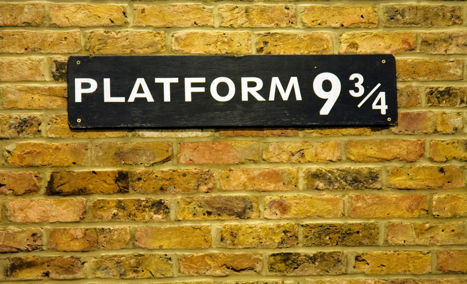Close up of the sign at Platform 9 3/4 at Kings Cross Station - one of the Harry Potter locations in London not to miss