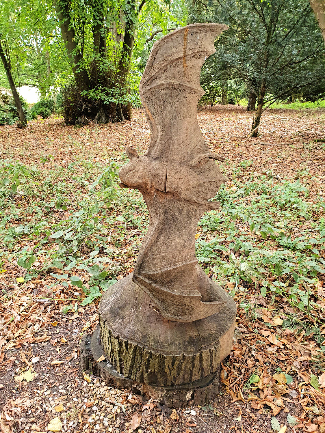 Wooden bat sculpture in the woods at Oxburgh Hall in Norfolk - a day out at Oxburgh Hall with kids