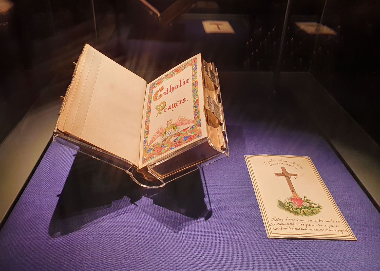 A Catholic prayer book on display in a glass case - a day out at Oxburgh Hall in Norfolk with kids