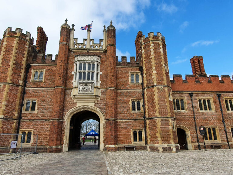 View of the entrance archway and red brick tower at Hampton Court Palace - a day out after lockdown at Hampton Court Palace with kids