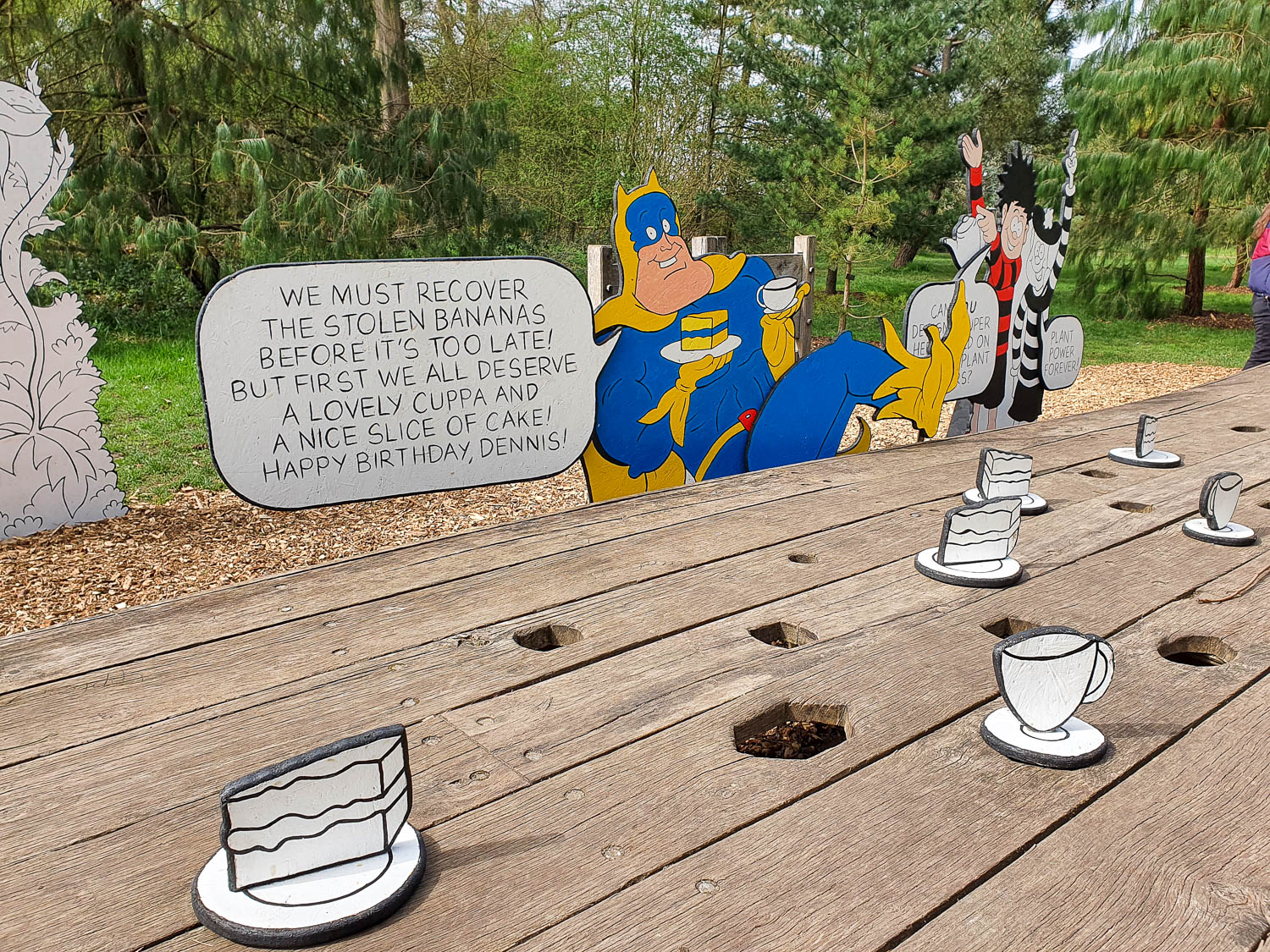 Bananaman cutout figure with Dennise the Menace at the end of the kids' trail for Easter at Kew Gardens
