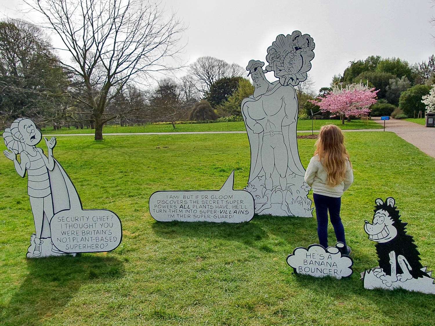 My daughter with cut out Beano characters as part of the kids trail for Easter at Kew Gardens