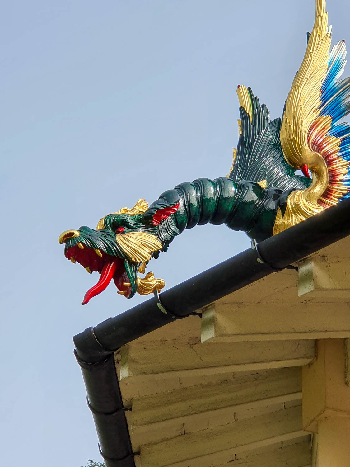 One of the blue and gold dragons on the corner of the pagoda at Kew Gardens - a family day out for Easter at Kew