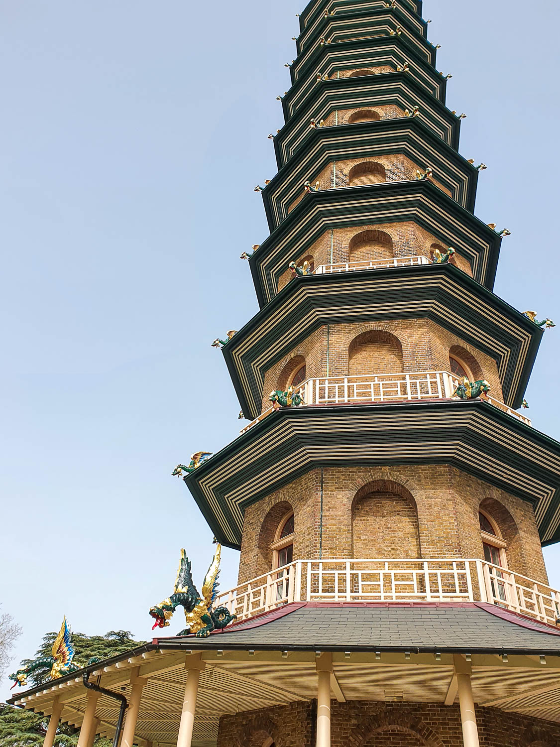 View of the pagoda at Kew Gardens against a blue sky, with dragons on each corner - a family visit for Easter at Kew Gardens