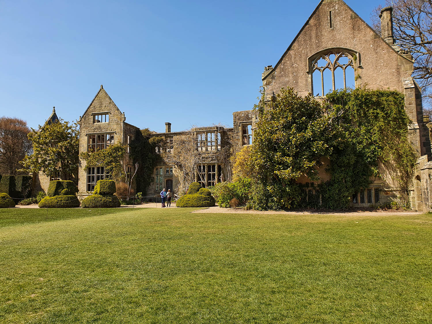 View across the grass to the ruined house at the Sussex National Trust property of Nymans - visiting Nymans with kids