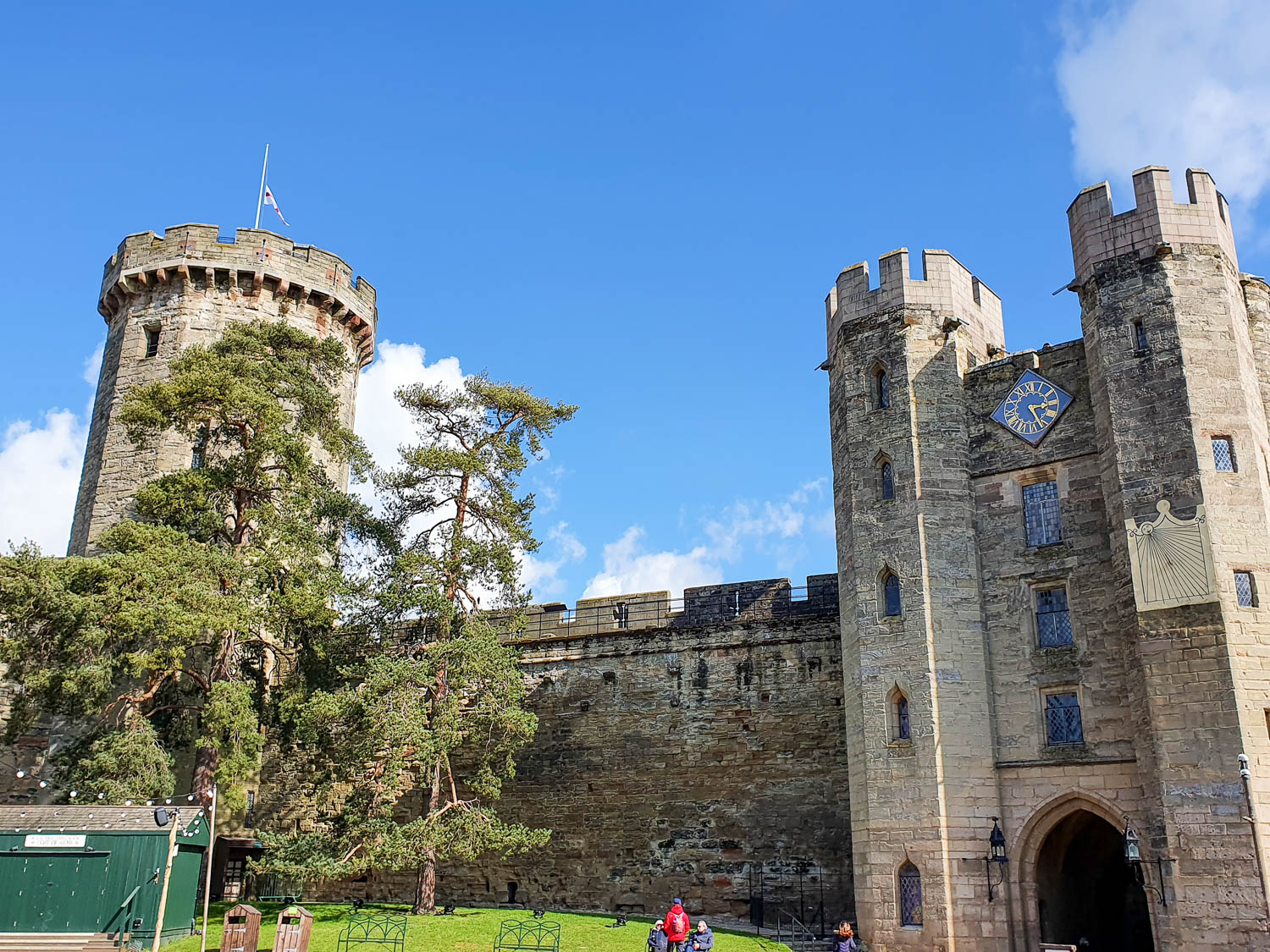 View of the clock on the tower entrance to Warwick Castle and walls - review of a day out at Warwick Castle with a toddler
