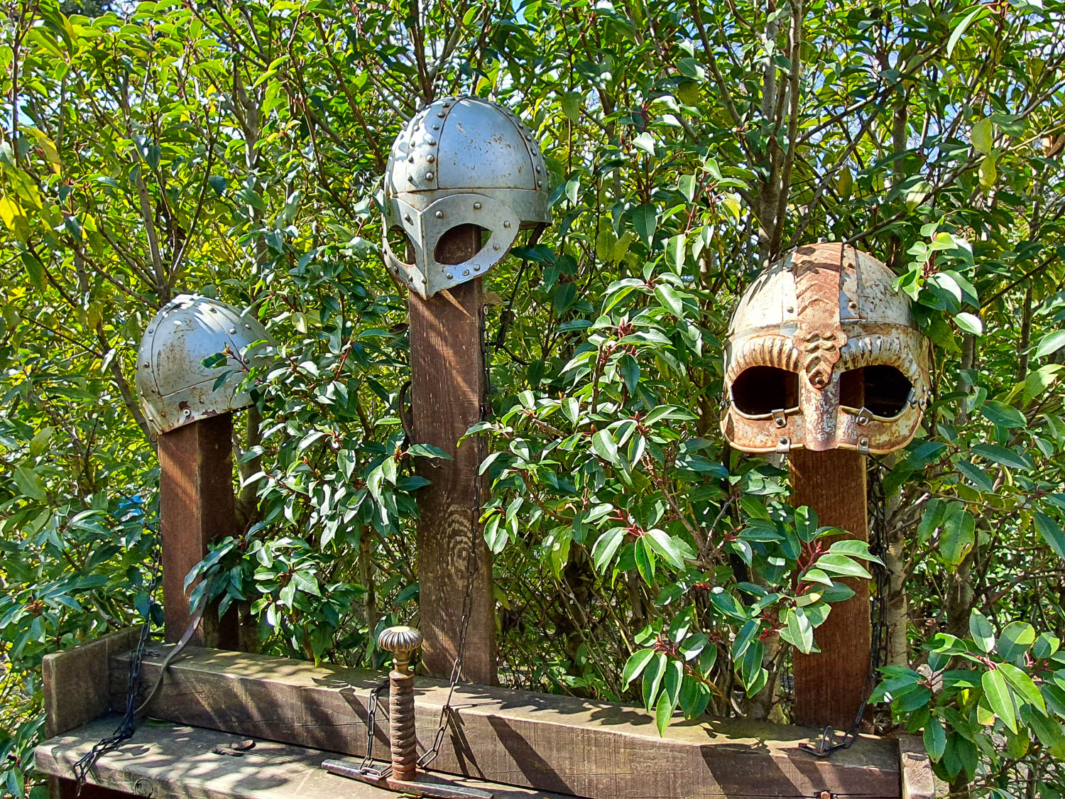 Helmets on wooden poles in the Stormin Normans section of the Horrible Histories Maze at Warwick Castle