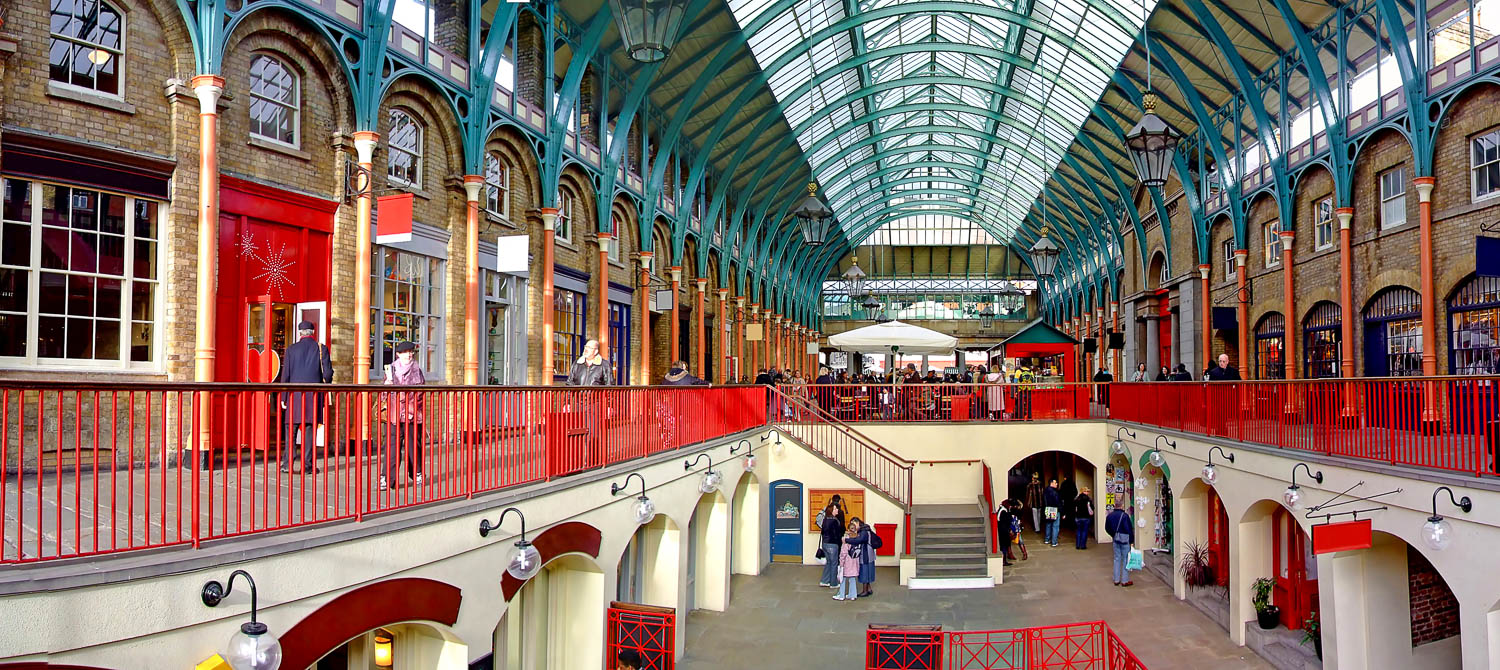 View across the shops inside Covent Garden market in London - picking the best hotels in London with kids, including places to stay near Covent Garden