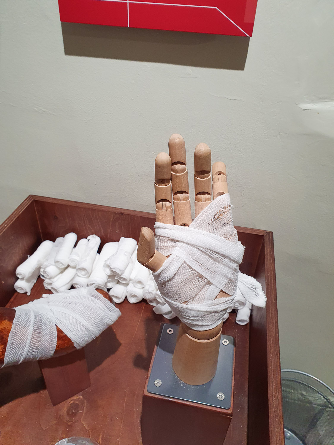 A model hand wrapped in a bandage after my daughter's attempt at treating a wound during our visit to the Thackray Museum with kids