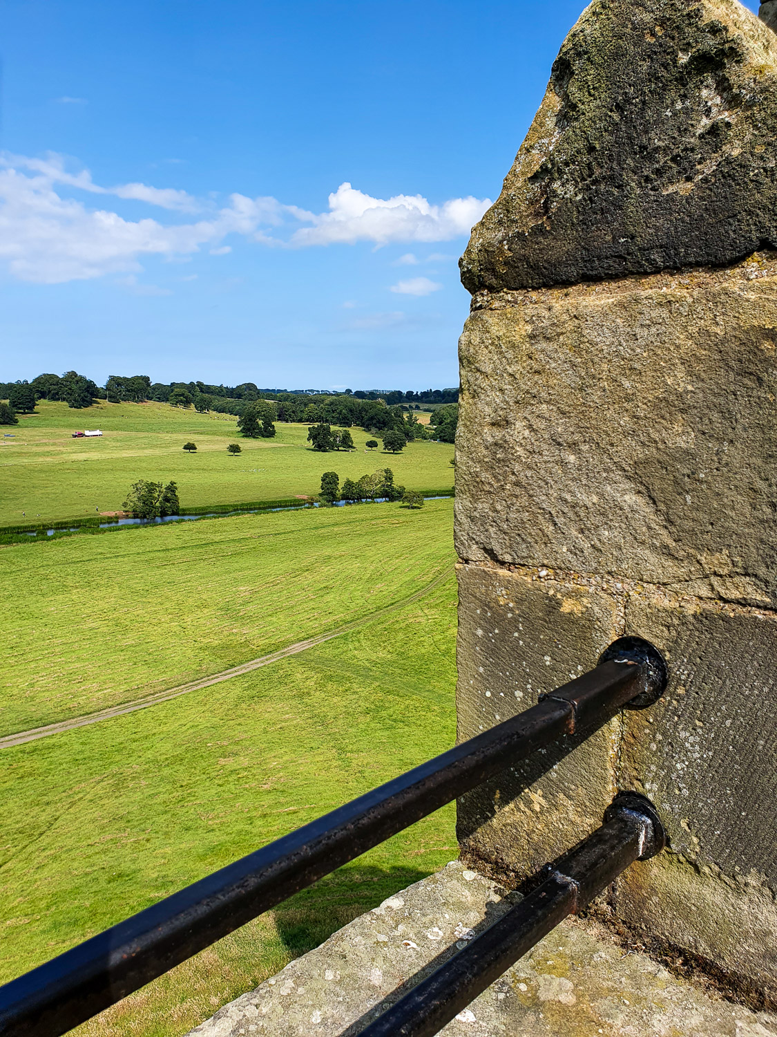View from the castle ramparts out to the countryside during a visit to Alnwick Castle with kids