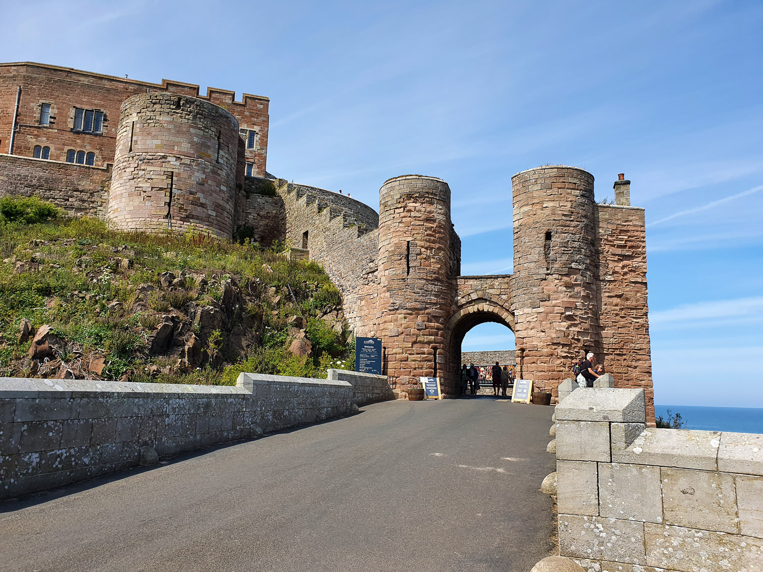View up to the arched gateway among the towers at the entrance to Bamburgh Castle, Northumberland