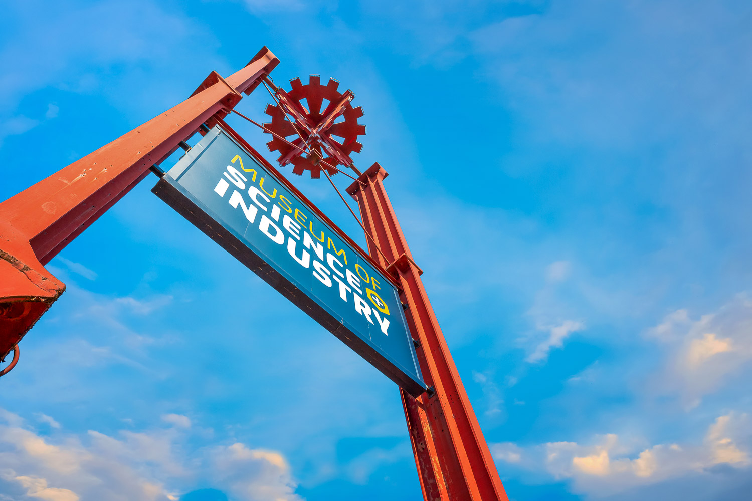 Sign for the Science and Industry Museum in Manchester against a blue sky - one of the best museums for kids in Manchester, UK