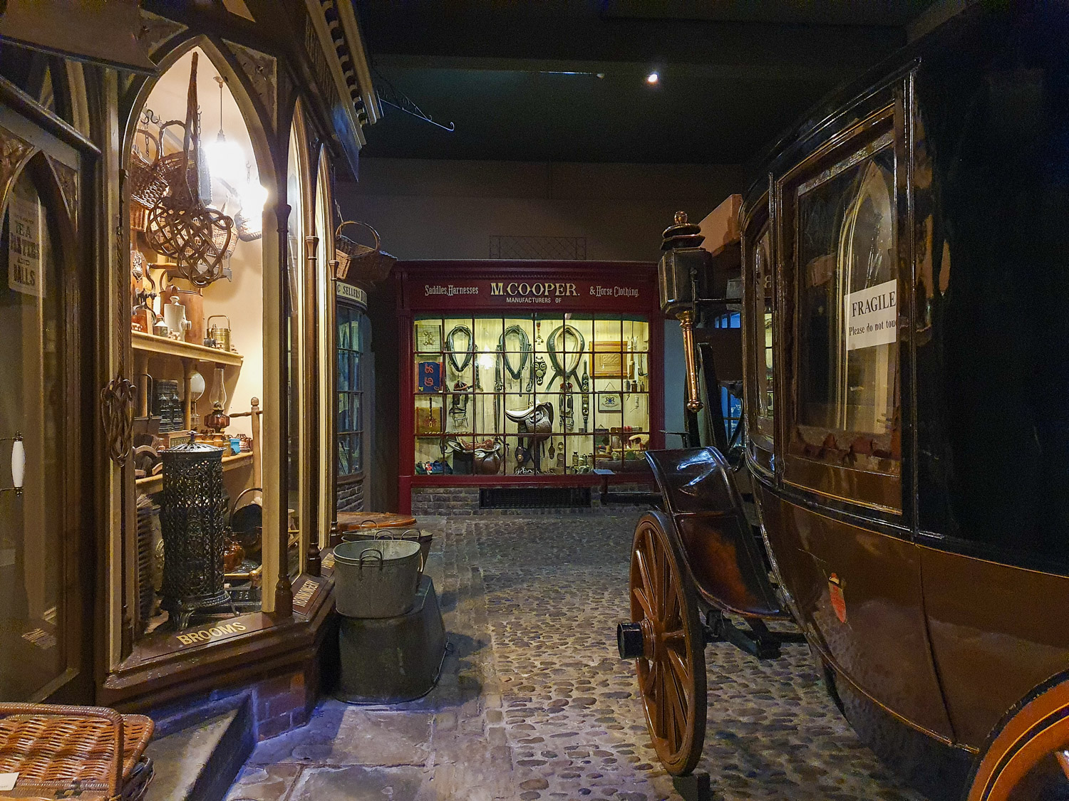 The period street with carriage and authentic shops including saddles at York Castle Museum - my review of a visit with kids