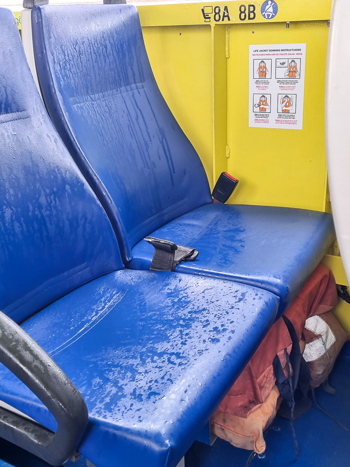 View of a wet blue seat and yellow side of the amphibious vehicle after plunging into the water of the river Tagus in Lisbon on our Hippotrip tour with kids - my review