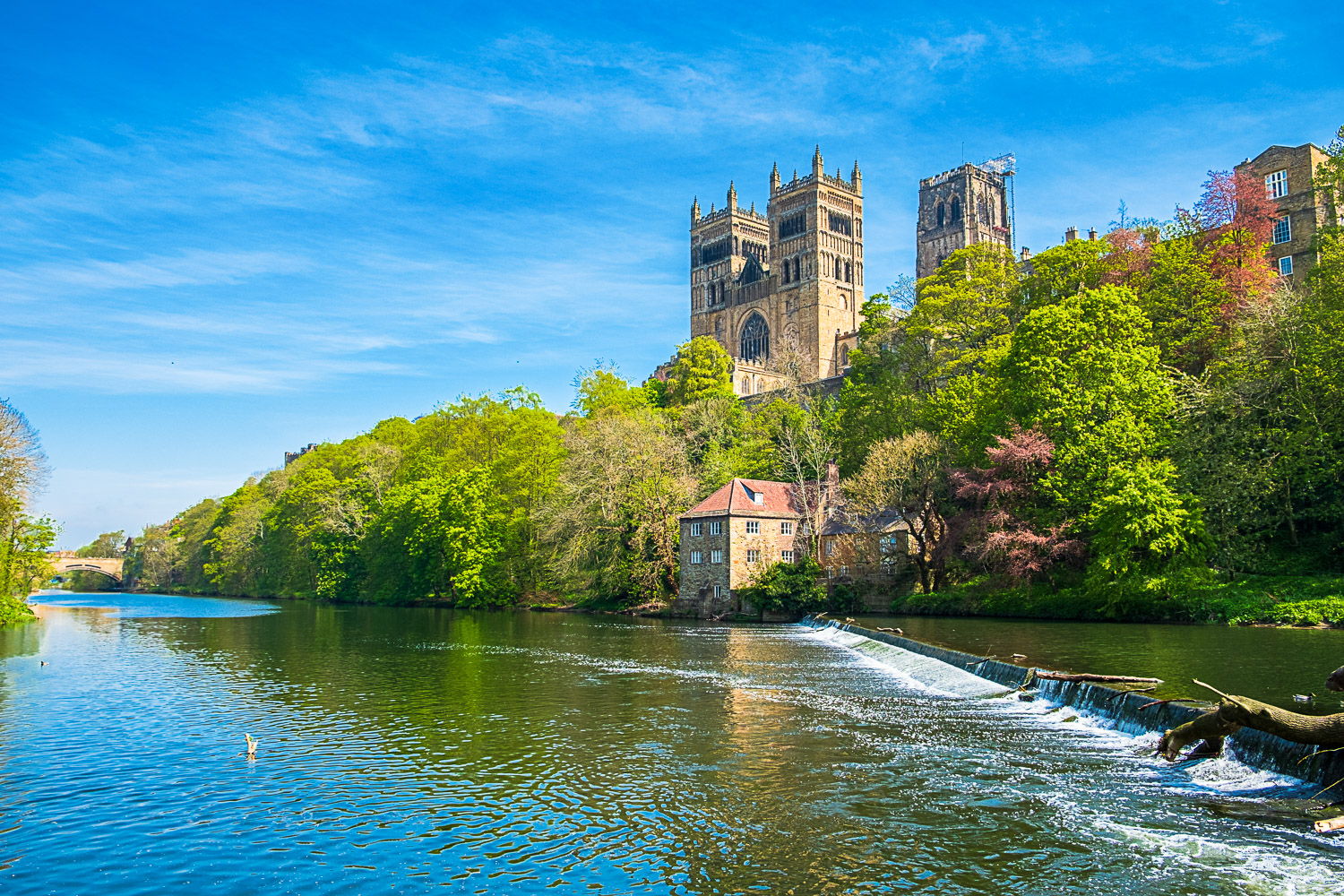 View of Durham Cathedral and River Wear on a sunny day - one of the best Unesco World Heritage sites in the UK with kids