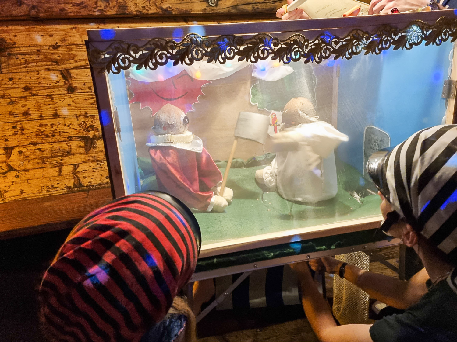 My daughter and friend operate a pair of puppets as part of the Golden Hinde escape room in London with kids - my Escape from the Golden Hinde review