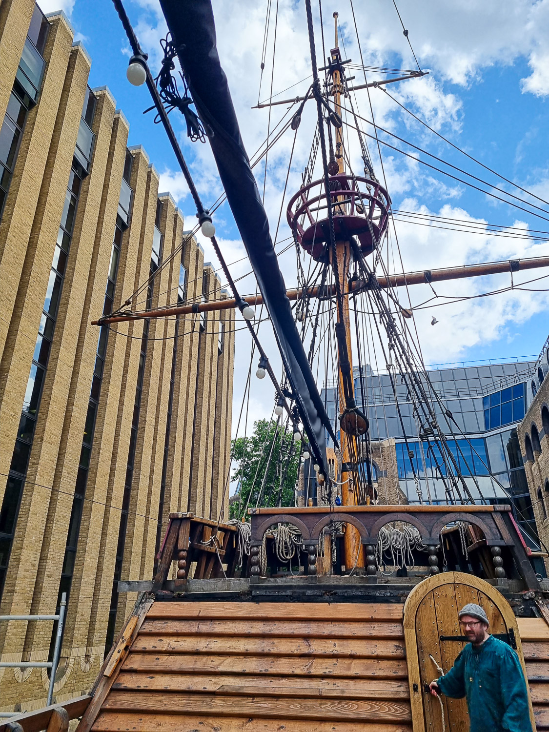View from deck of crew member Stinky Pete opening the wooden door into the Golden Hinde for the start of the escape room - my Escape from the Golden Hinde review