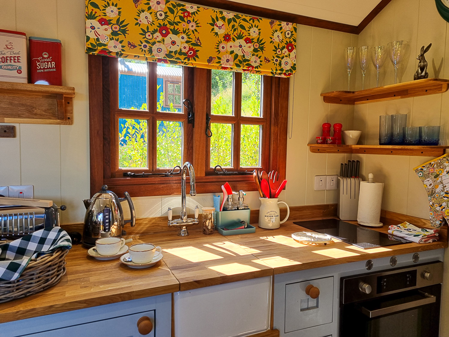 View of the kitchen work surfaces and oven, in one of the shepherd's huts at Dittisham Hideaway - my review of the Devon luxury glamping site