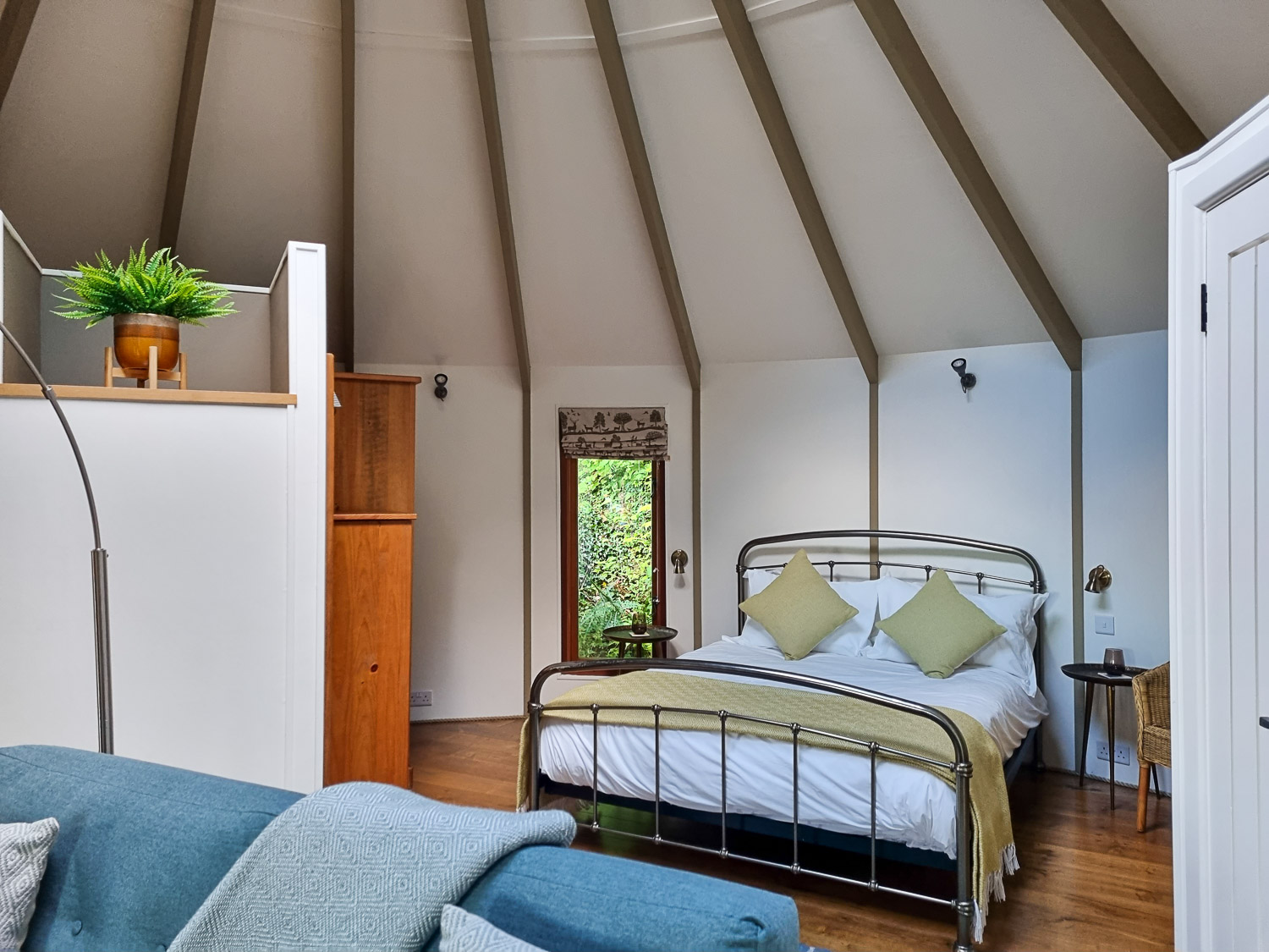 View towards the double bed and bedroom area at Owl treehouse - my Dittisham Hideaway review after a luxury glamping break in Devon with kids