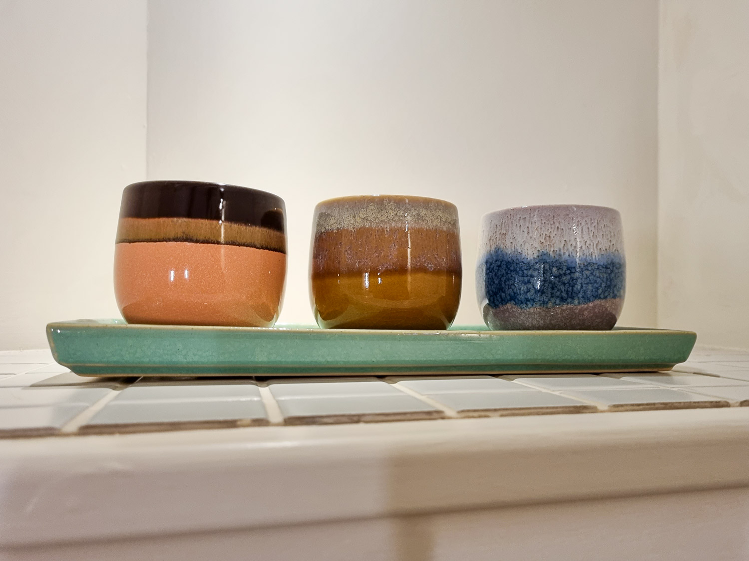 View of three ceramic pots on a tray in one of the bathrooms in Owl treehouse - my Dittisham Hideaway review