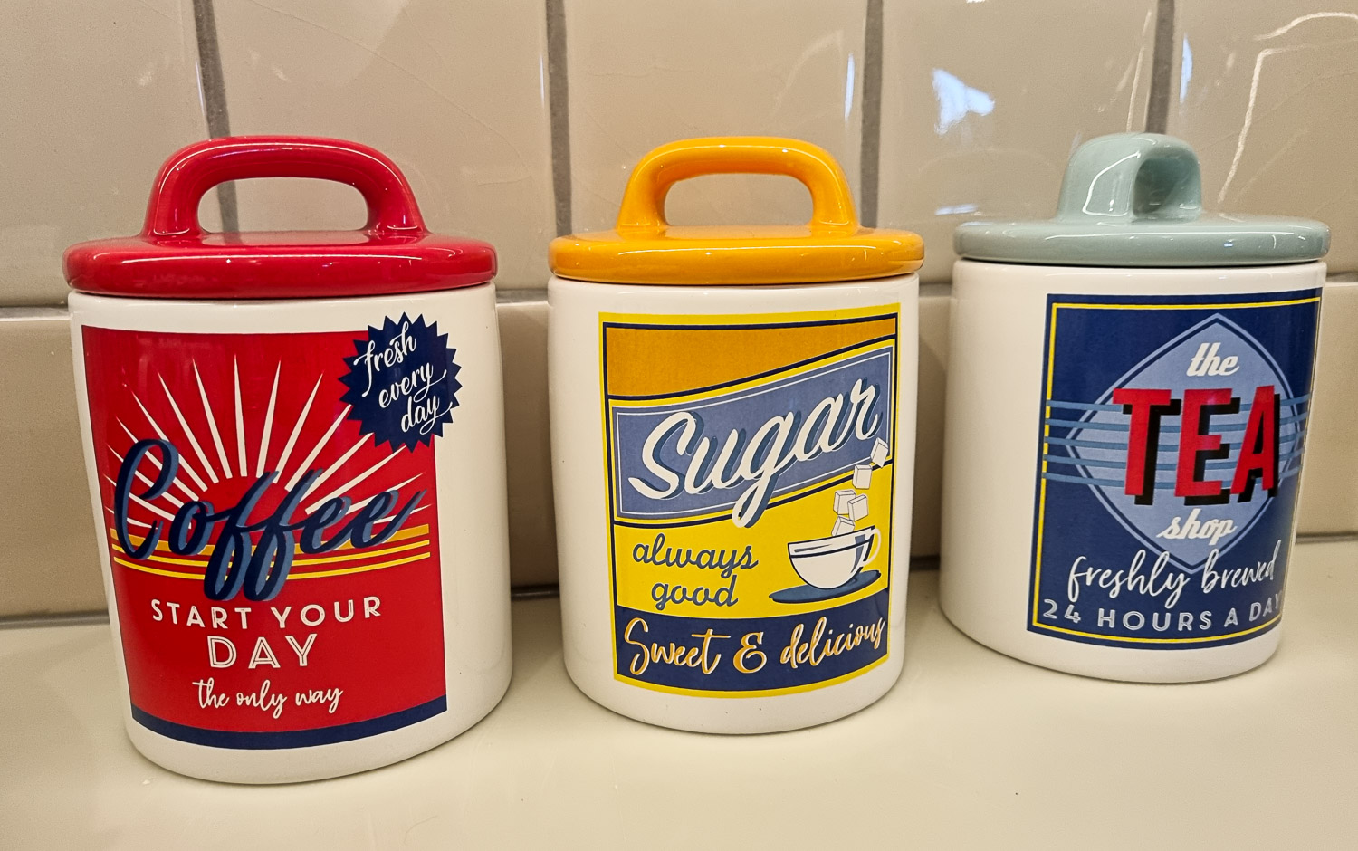 Three retro style jars for coffee, sugar and tea in the kitchen of Owl treehouse - my Dittisham Hideaway review after a stay at the luxury Devon glamping site